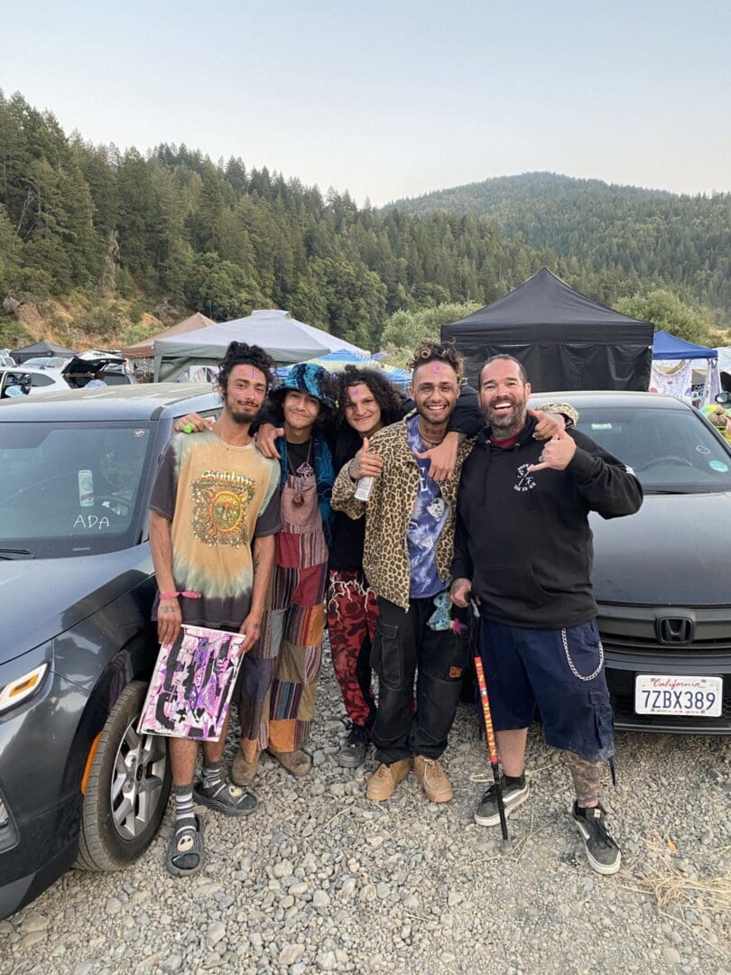 Festival attendees wearing colorful eclectic outfits