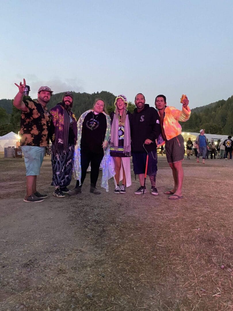 Evening festival group with forested hills