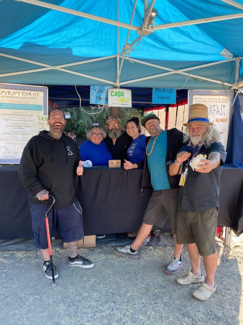 Team serving gyros at outdoor stall
